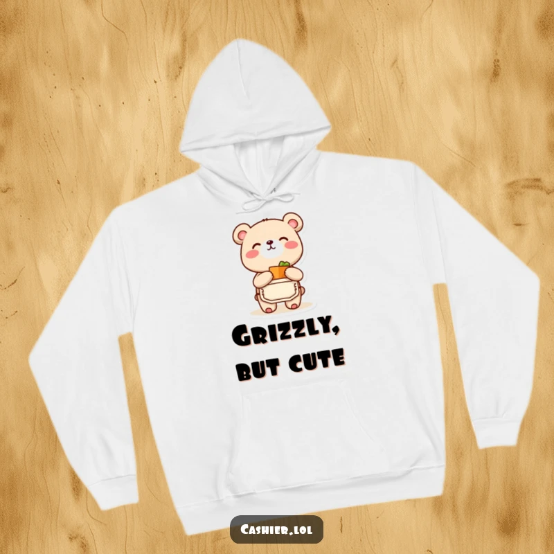 Funny and cozy hoodie design featuring a bear cub in an apron, joyfully bagging a small item, ideal for a funny gift.